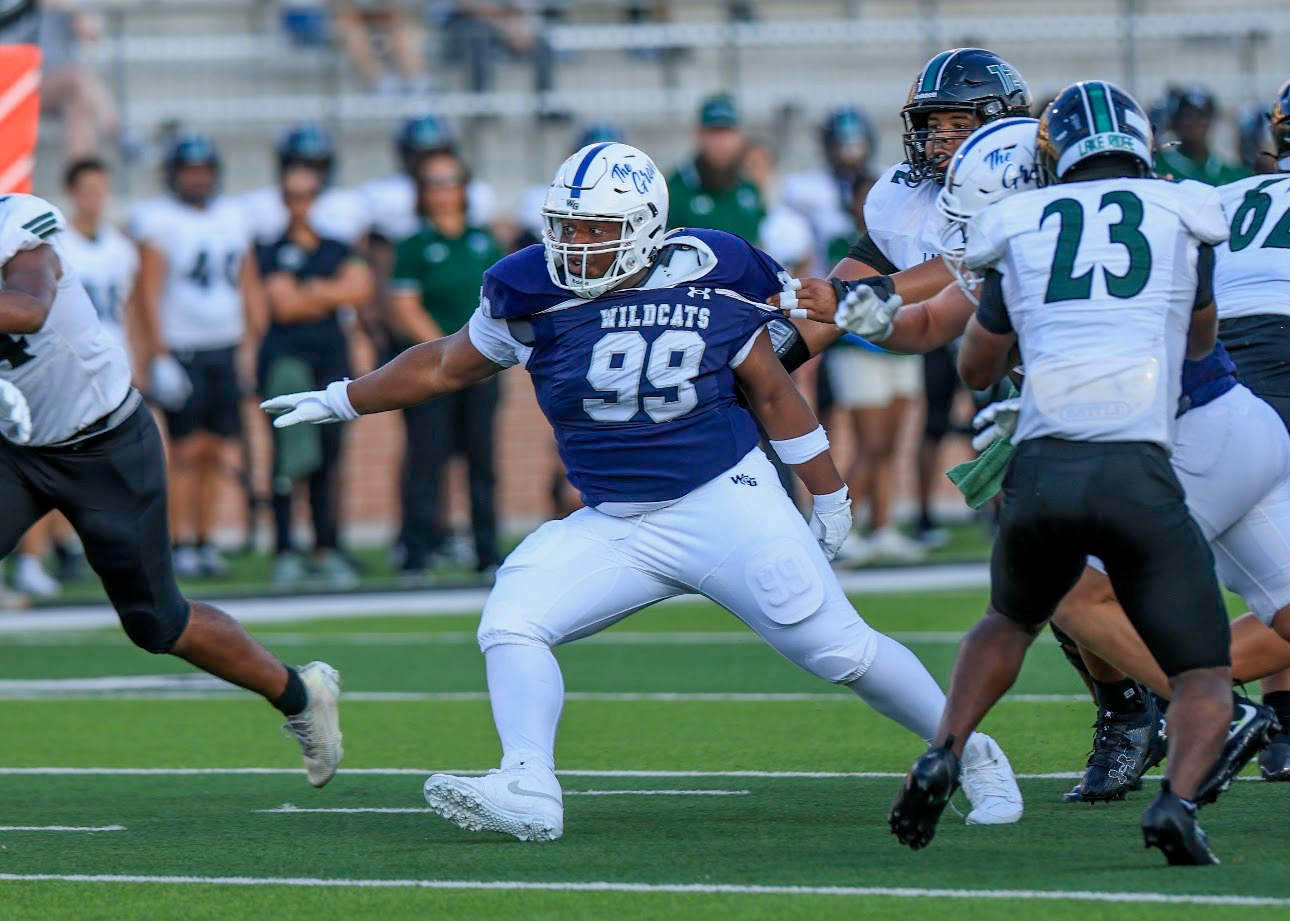 Kristopher Williams in pursuit with his arm extended against Lake Ridge