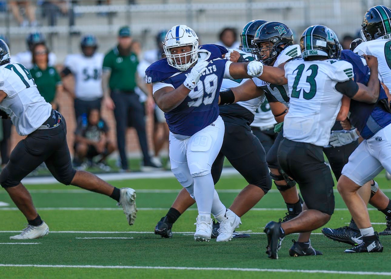 Kristopher Williams taking on a block against Lake Ridge